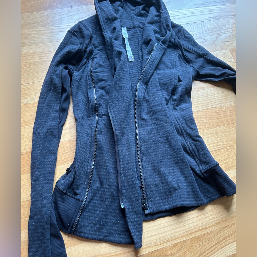 Unique lululemon zip up. Crosses over in the front with two zippers. Black/ grey